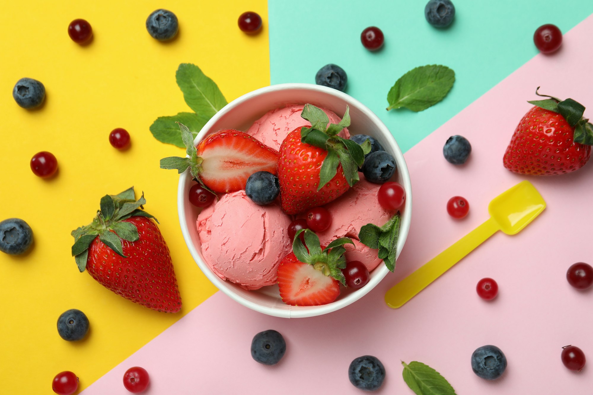 Fruit ice cream and ingredients on color background